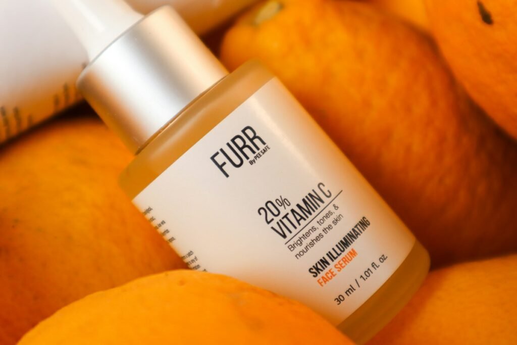 Vitamin C Serum Benefits for Skin: How to Use It and What to Expect Vitamin C serum dropper with fresh citrus fruits for skincare